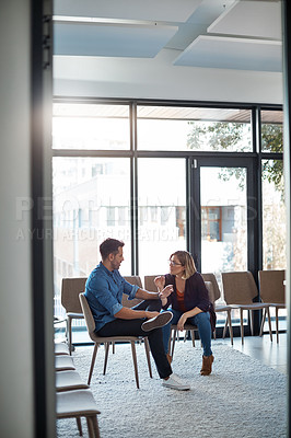 Buy stock photo Serious, professional business woman talking to work colleague in modern startup office. Manager having casual conversation with male employee. Coworkers meeting and discussing plans for a project 