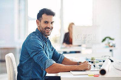 Buy stock photo Happy creative businessman working at his desk, doing admin and taking notes while in an office at work. Portrait of a cheerful, smiling and professional male with a positive attitude and expression