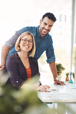 Buy stock photo Teamwork between colleagues, coworkers and business partners working together in an office to achieve success. Portrait of two employees looking happy, confident and ready in their design company