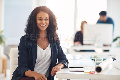 Buy stock photo Portrait of a young woman working at her desk in a modern office
