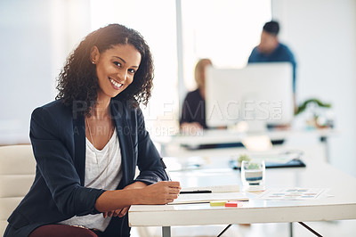 Buy stock photo Happy corporate business woman working at her desk, doing admin and taking notes while in an office at work. Portrait of a cheerful, joyful and professional female writing in a notebook at a table