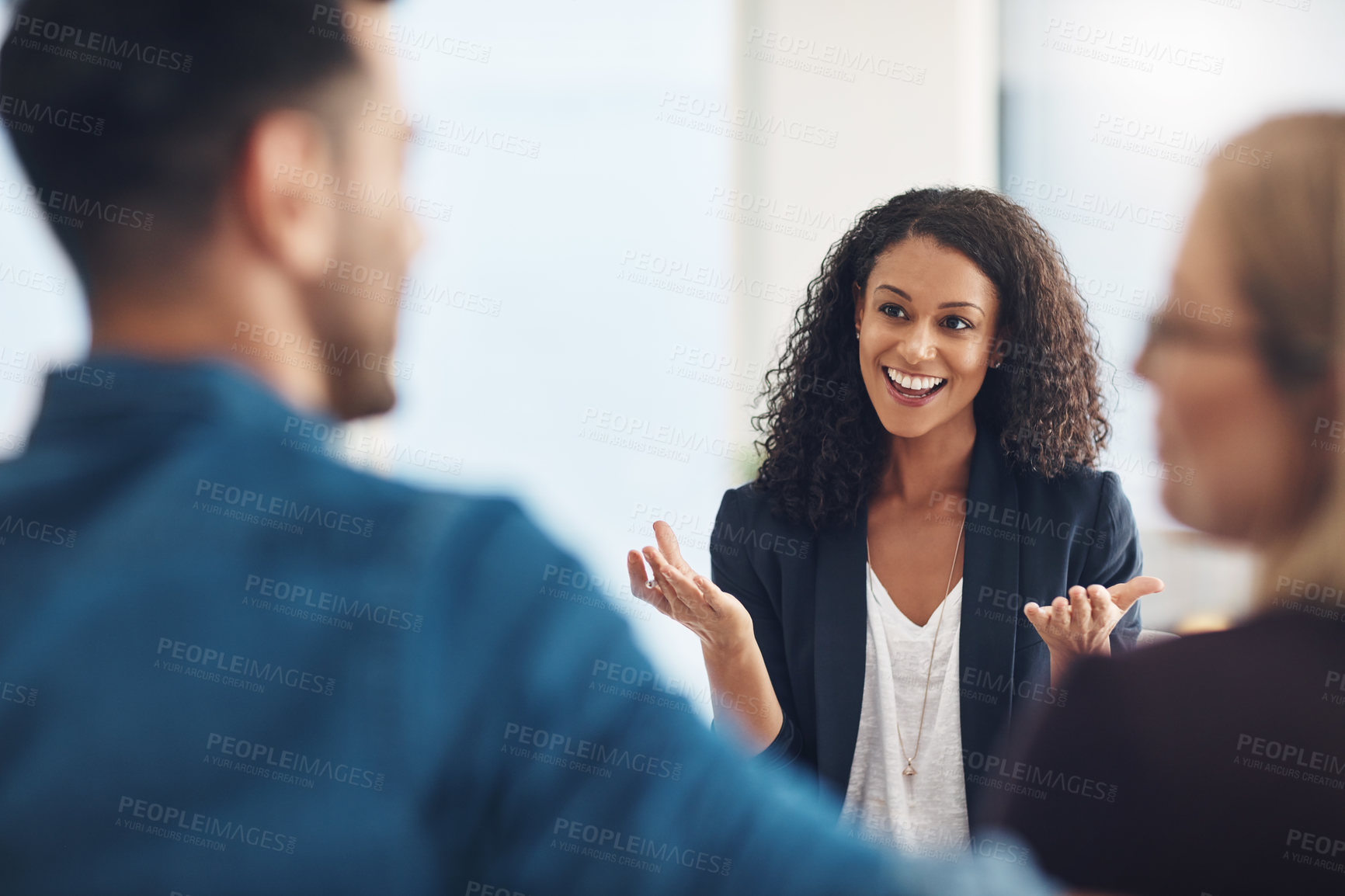 Buy stock photo Shot of a young therapist speaking to a couple during a counseling session