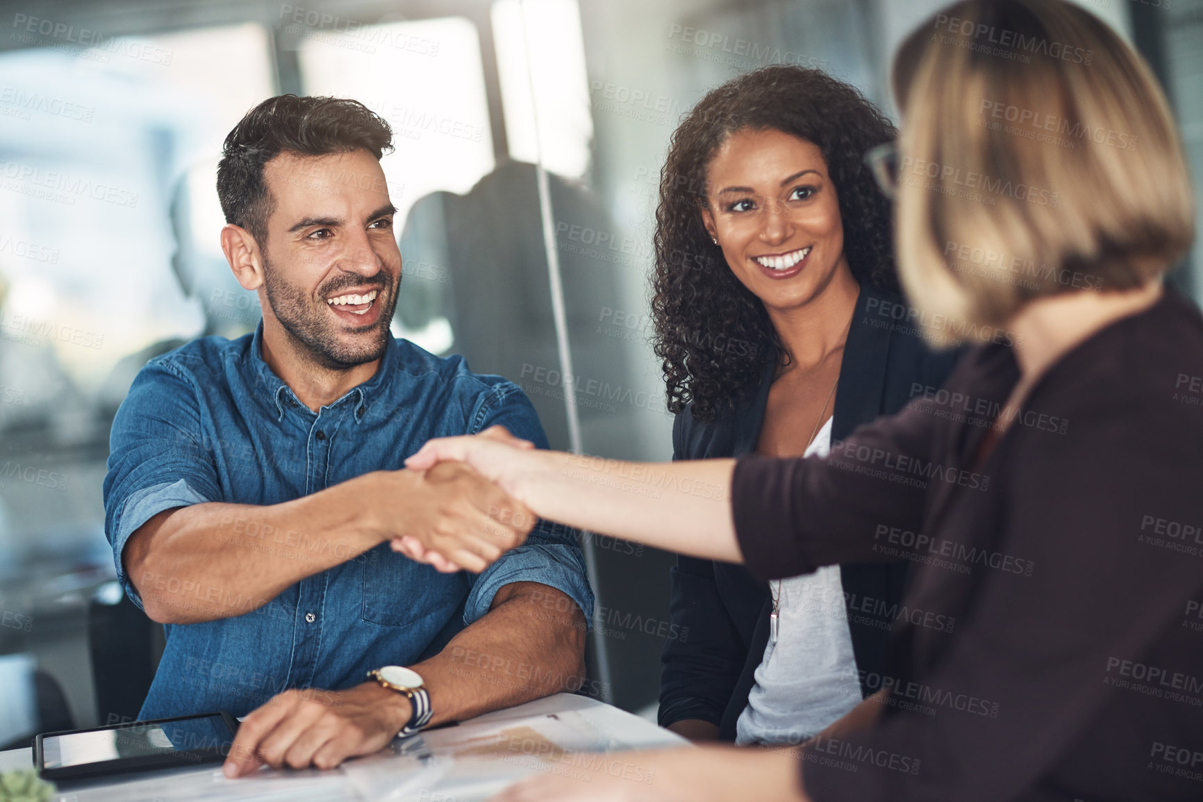 Buy stock photo Handshake and teamwork by business people, colleagues and coworkers in a meeting, discussion or negotiating at work. Corporate professionals greet, make a deal and collaborate in an office boardroom