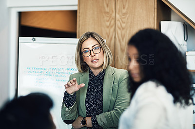 Buy stock photo Presentation meeting, audience and business woman brainstorming, planning and talking to listening strategy team. Project management, collaboration and manager speech, report or discussion with group