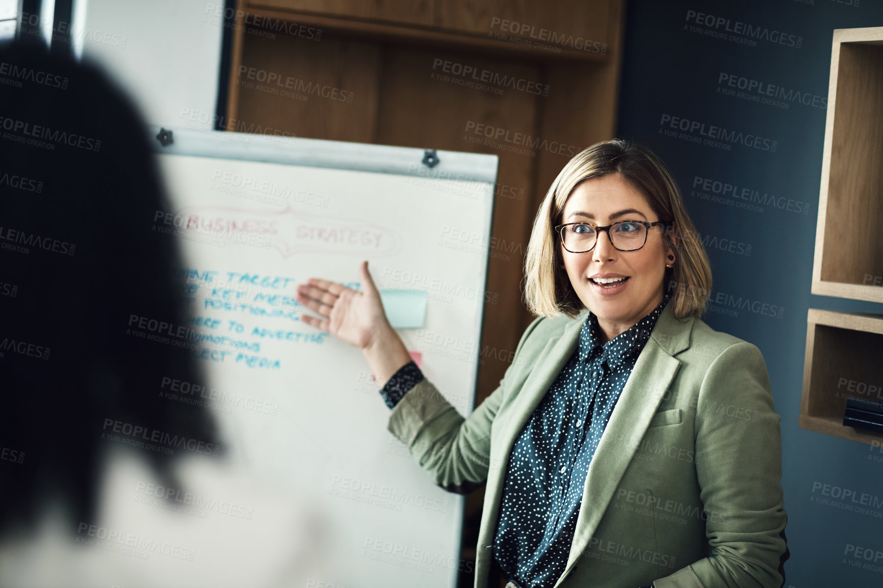 Buy stock photo Presentation meeting, whiteboard and woman explain strategy, business plan or brainstorming ideas, coaching or teaching team. Group mentor, coach or startup leader talking to professional workforce