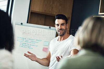 Buy stock photo Presentation meeting, whiteboard and man explain strategy, business plan or brainstorming ideas, coaching or teaching team. Group mentor, coach or startup leader speaking to creative design staff