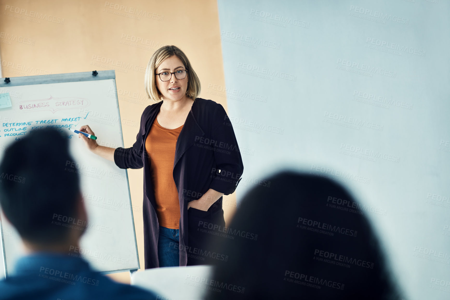 Buy stock photo Shot of a group of colleagues having a brainstorming session in a modern office