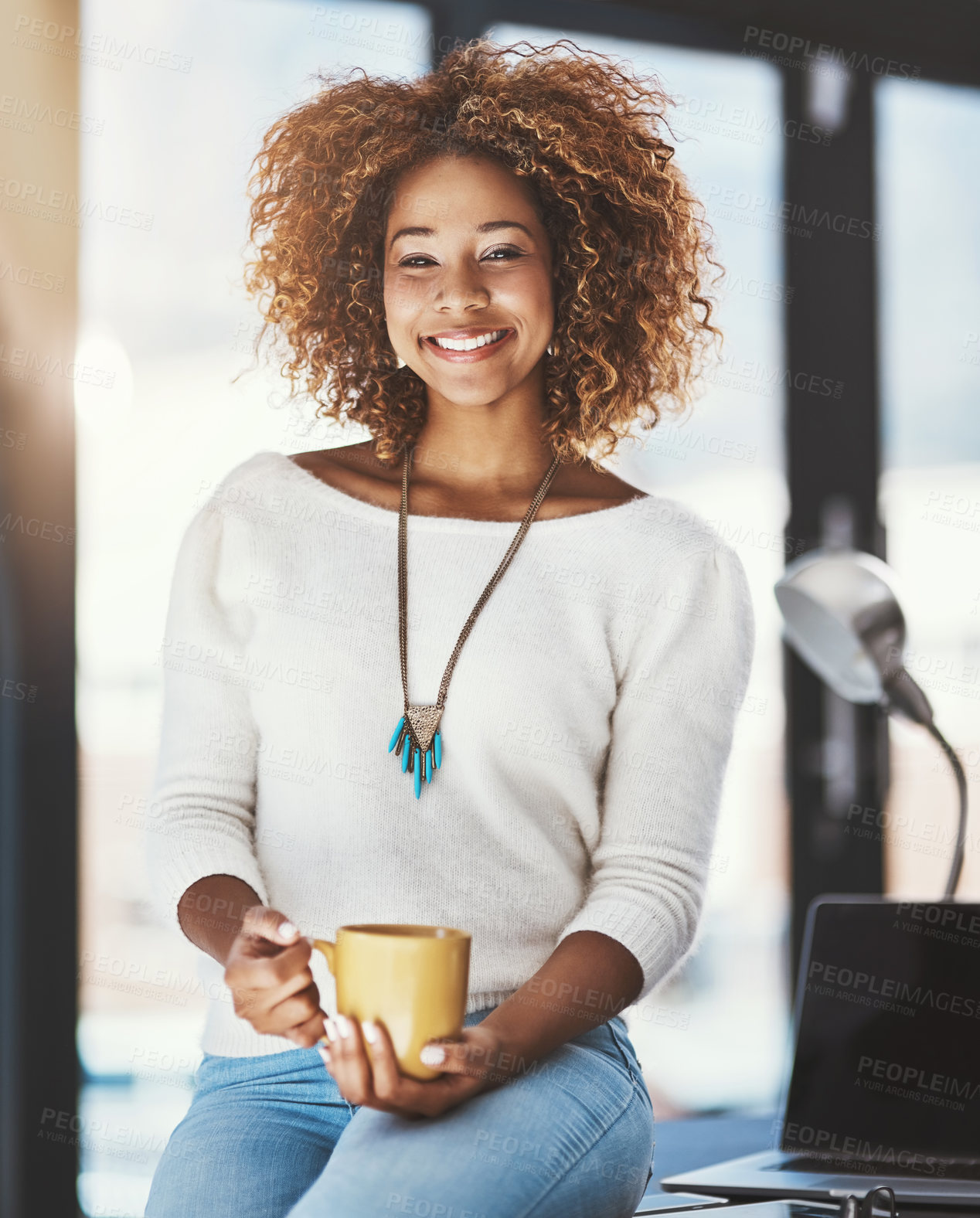 Buy stock photo Black girl, creative and coffee in office with portrait, happy and laptop for media work in journalism. Woman, morning beverage for drinking with relax on desk, entrepreneur and startup agency.