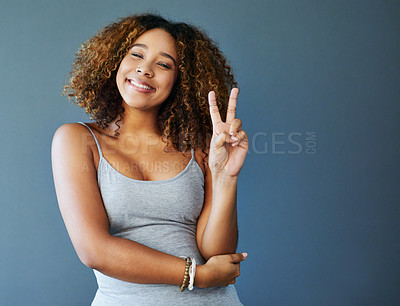 Buy stock photo Girl, happy and peace sign with studio portrait, emoji and mockup space for vote by background. Woman, person and model with smile for pride with v icon, symbol or excited with confidence in Colombia