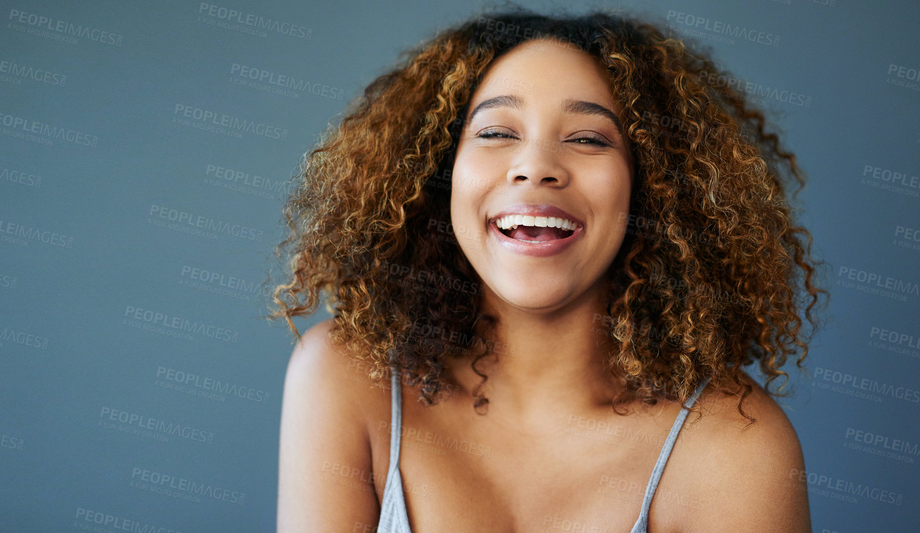 Buy stock photo Woman, portrait and laughing in studio for funny joke, confident comedy and blue background. Female person, happiness and mockup space for humor on backdrop, smile and satisfaction for wellness