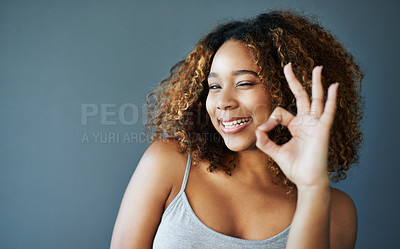 Buy stock photo Woman, happy and ok sign with studio portrait, emoji and decision with agreement by background. Girl, person and model with joke with icon, funny and mockup space for choice with wink in Costa Rica