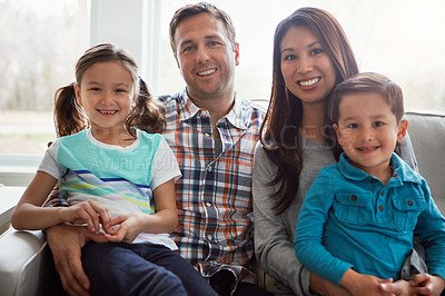 Buy stock photo Portrait, children and happy family in home with parents together for care, love or bonding. Face, mother and father with kids on sofa for support, connection or relationship with siblings in lounge