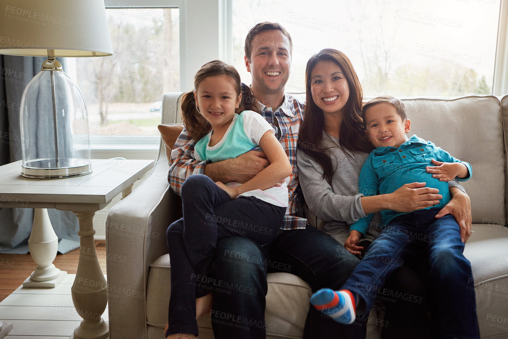 Buy stock photo Portrait, kids and happy family in house with parents together for care, love and bonding. Relax, mother and father with children on sofa for support, connection or laughing with siblings in lounge