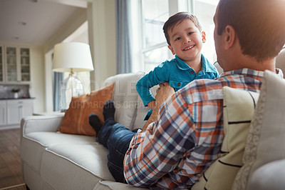 Buy stock photo Home, happy and father with child on sofa for bonding, laughing and relax together on weekend. Family, playing and dad with young boy on couch for playful relationship, love and fun in living room