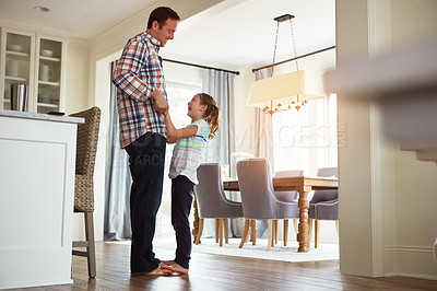 Buy stock photo Father, girl or dancing in house on feet together, growth or development with role model. Dad, happy dancer or playful in home for learning or bonding, superhero parent with princess for family