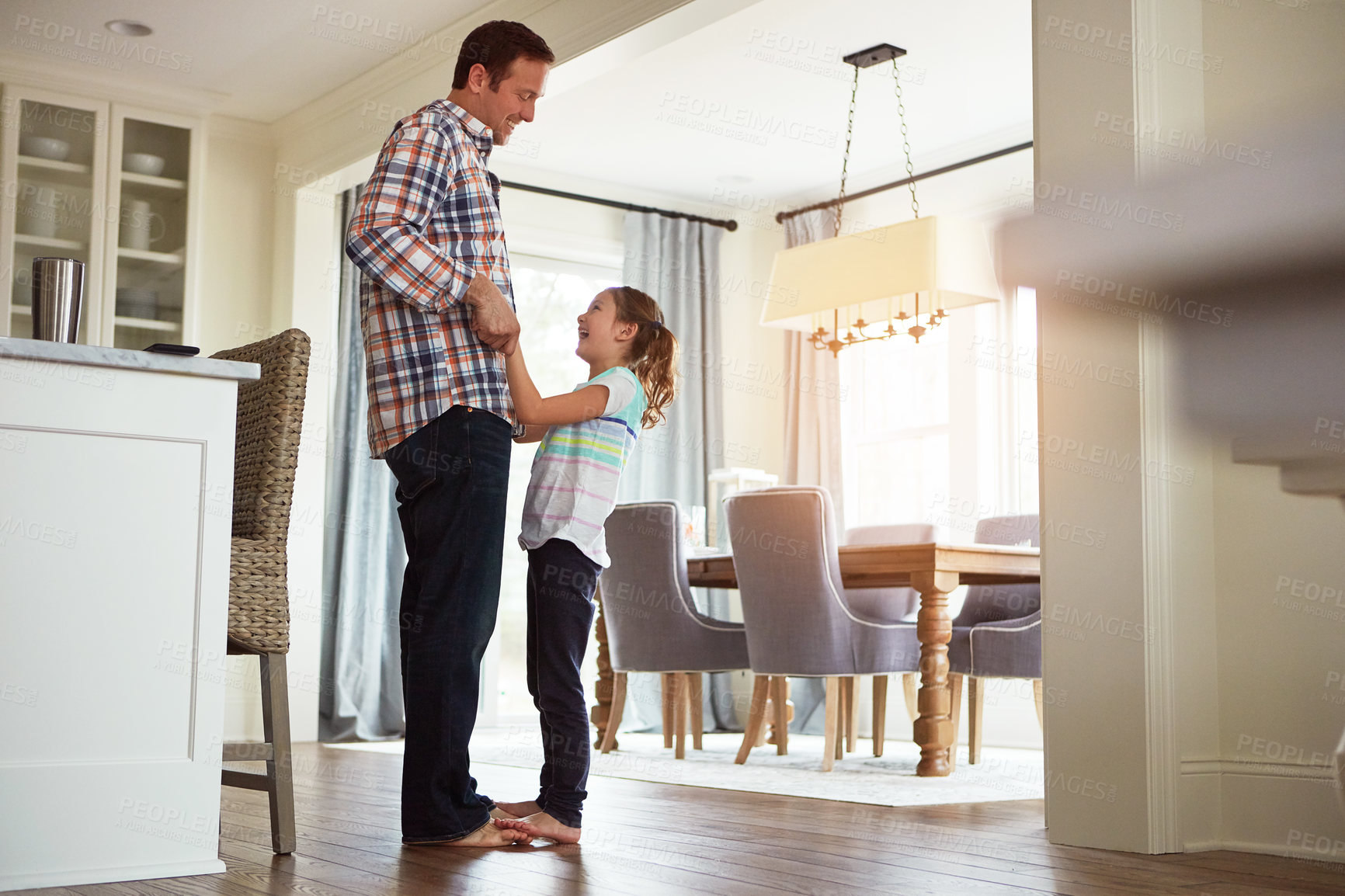 Buy stock photo Father, girl or dancing in house on feet together, growth or development with role model. Dad, happy dancer or playful in home for learning or bonding, superhero parent with princess for family