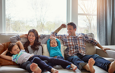 Buy stock photo Relax, kids and happy family in home with parents together for care, love or bonding. Children, mother and father on sofa for support, conversation or play with funny siblings laughing in living room