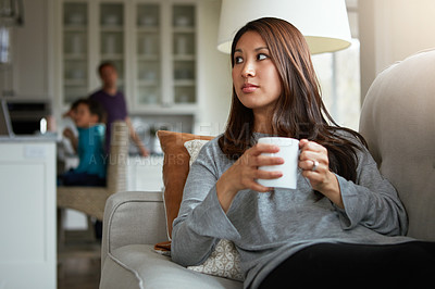 Buy stock photo Morning, thinking and woman with coffee on sofa for mindset, relax or weekend break in living room. Comfortable, thoughtful and mother with warm beverage for peace, memory or drinking tea in home