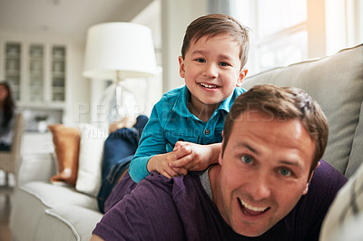 Buy stock photo Portrait, happy and father with child on sofa for bonding, laughing and relax together on weekend. Family, playing and dad with young boy at home for playful relationship, love or fun in living room