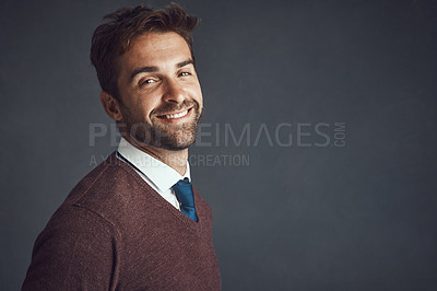 Buy stock photo Studio portrait of a stylishly dressed young man posing against a gray background