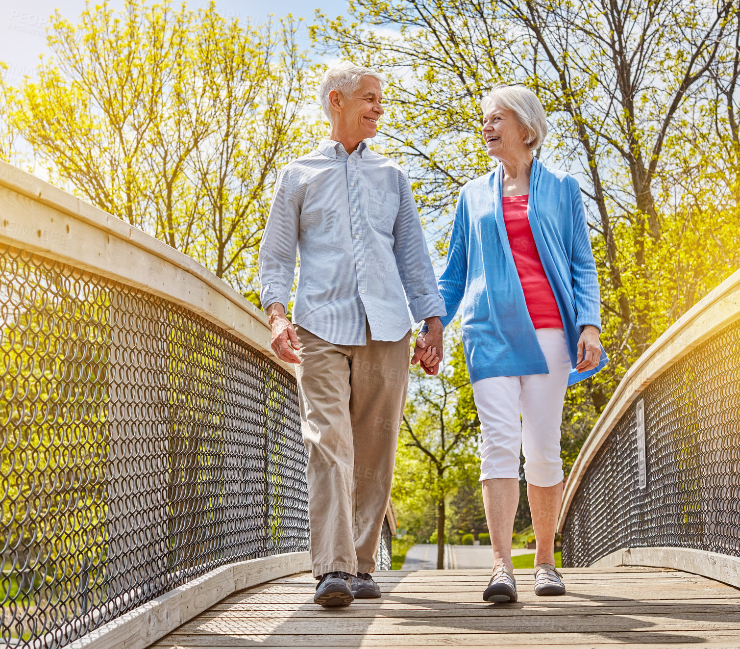 Buy stock photo Shot of a happy senior couple going for a relaxing walk together outside