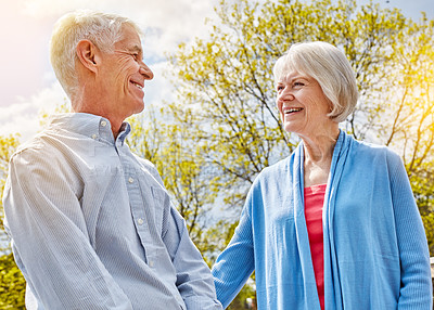 Buy stock photo Shot of a happy senior couple spending time together outside