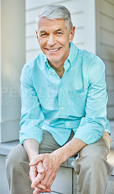 Buy stock photo Cropped portrait of a senior man sitting on his porch during the summer