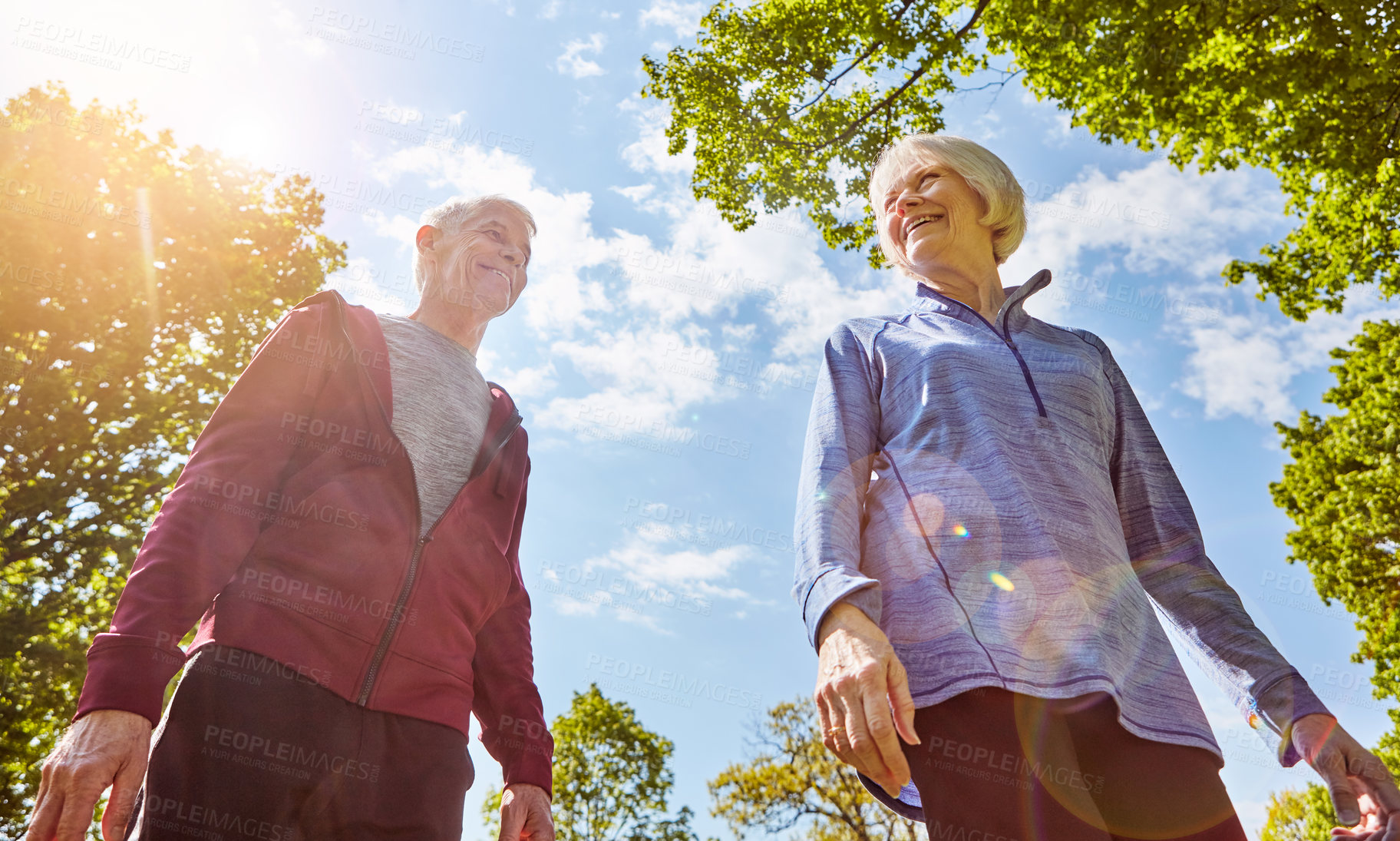 Buy stock photo Senior couple, happiness and retirement in nature for life insurance, security and walk in park. Elderly man, woman and together for support with cover, laughing or fitness outdoors in Australia 