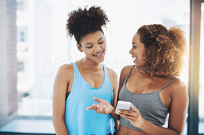 Buy stock photo Women, friends and chat with smartphone for fitness at gym on social media for exercise videos or tips. People, happy and communication with networking or mobile app for training instructions