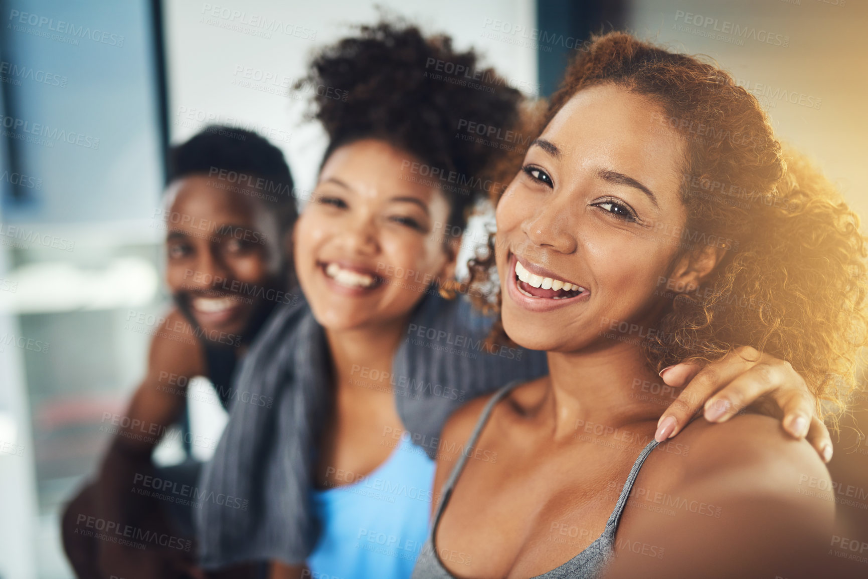 Buy stock photo Portrait shot of three young friends taking a selfie together inside of a studio