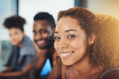 Buy stock photo Portrait shot of three young friends taking a break from a workout session while looking at the camera inside of a studio