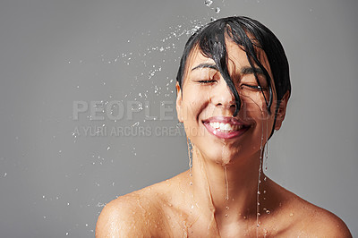 Buy stock photo Shower, happy and face of woman with water in studio on gray background for wellness, cleaning and grooming. Skincare, bathroom and female person with beauty for washing hair, body care and hygiene