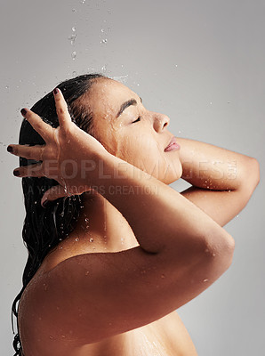 Buy stock photo Shower, washing hair and profile of woman with water in studio for wellness, cleaning and grooming. Beauty, bathroom and face of female person for hygiene, body care and cleansing on gray background
