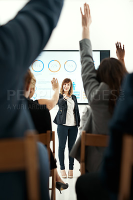 Buy stock photo Businesswoman, presentation and hands up for questions in audience with graphs, review or market research. Female person, coworkers and back in meeting for group seminar, statistics or percentage