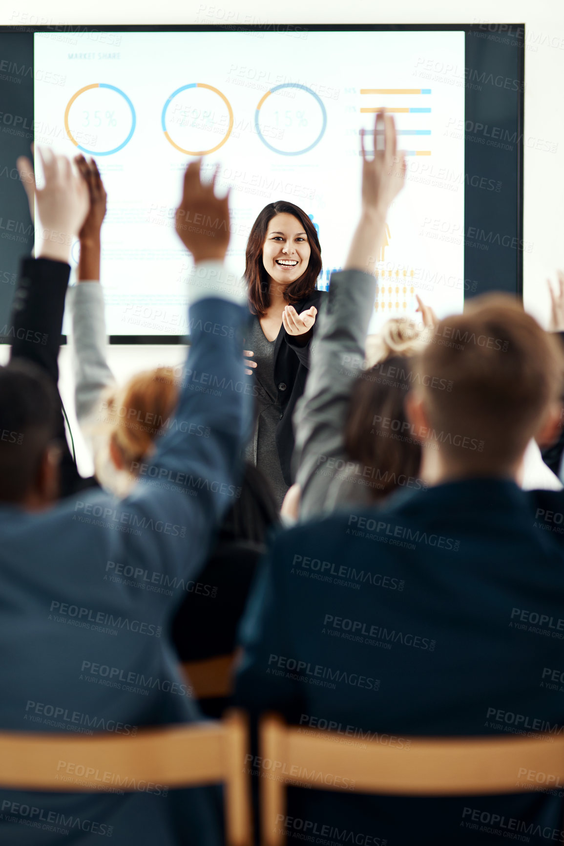 Buy stock photo Businesswoman, presentation and hands up in audience for conference with graphs, review or questions. Female person, trade show and back in meeting convention for mentorship, statistics or percentage
