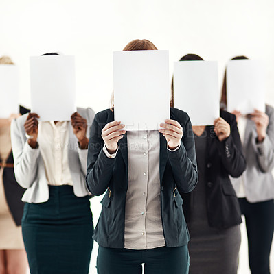 Buy stock photo Businesswoman, team and message on blank board in studio for anonymous recruitment of career. Professional, group and female people with empty paper hiding face for marketing as brand ambassador