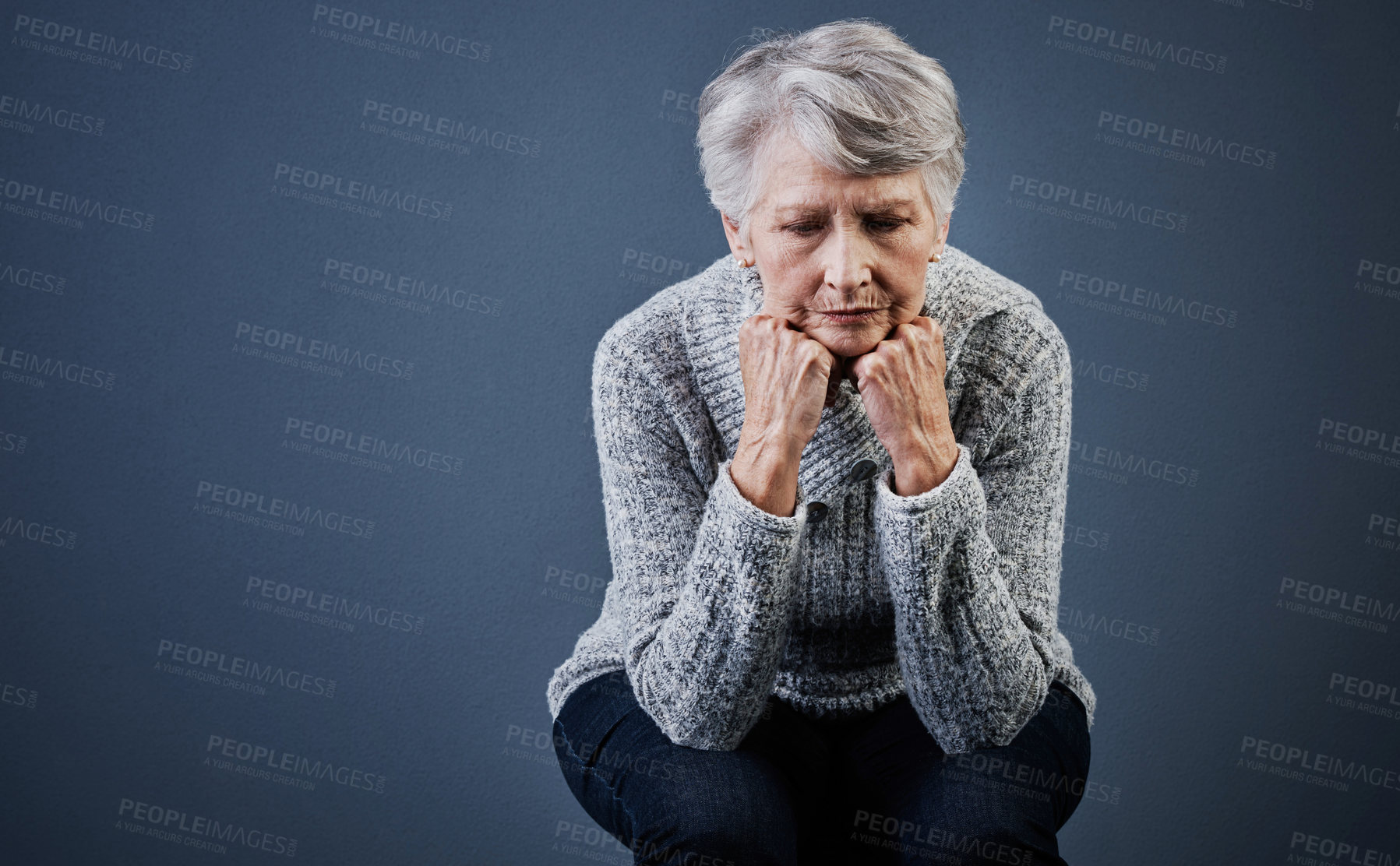 Buy stock photo Mental health, reflection and sad with old woman on gray background for psychology or wellness. Thinking, retirement and space with unhappy senior person in studio for alzheimer or dementia.