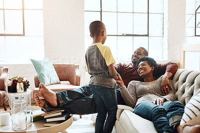 Buy stock photo Relax happy black family child, parents or African people smile together, bonding and enjoy quality time. Happiness, love and young youth kid, easy father and mother lounge on home living room sofa