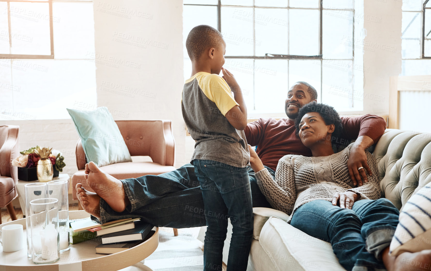 Buy stock photo Black family, parents and child in home with support, conversation and bonding together on weekend. Mother, father and son in living room with trust, relax and discussion for connection on holiday.