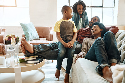 Buy stock photo Happy, relaxing and black family on sofa in home for hugging, love and care on fathers day for celebration. Smile, bonding and African kids with mom and day resting together in living room at house.