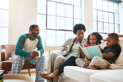 Buy stock photo Reading, bonding and black family with book on sofa for drinking coffee on fathers day at home. Smile, knowledge and African parents relaxing with children in living room with fantasy story or novel.