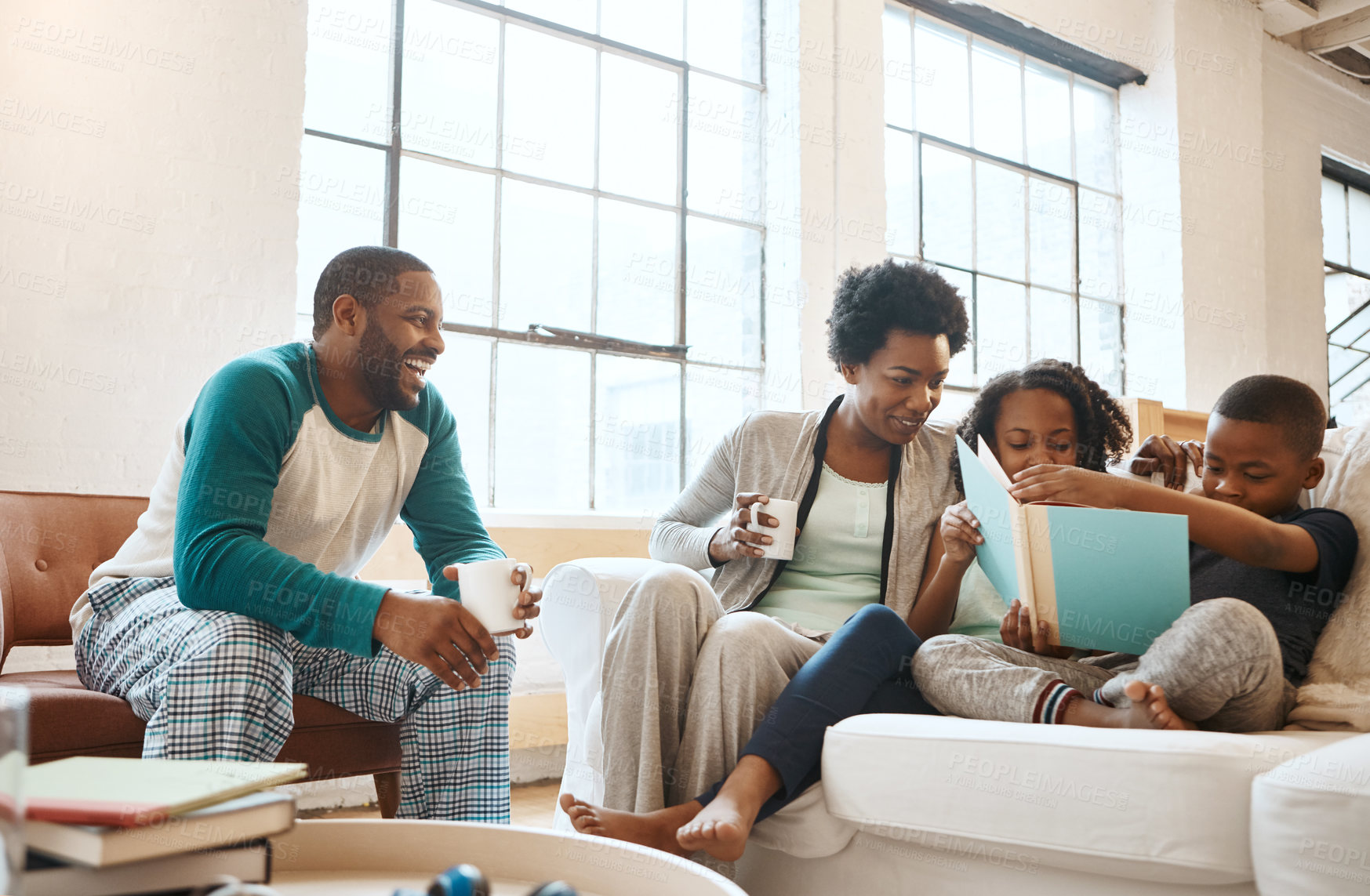 Buy stock photo Reading, relax and black family with book on sofa for bonding together on fathers day at home. Smile, knowledge and African parents drinking coffee with children in living room with story or novel.