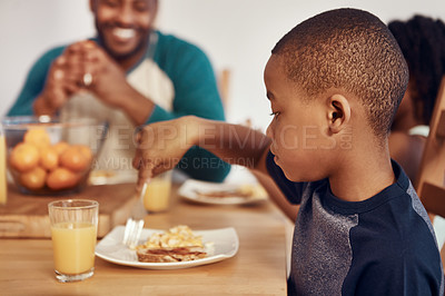 Buy stock photo Shot of a family having breakfast together at home