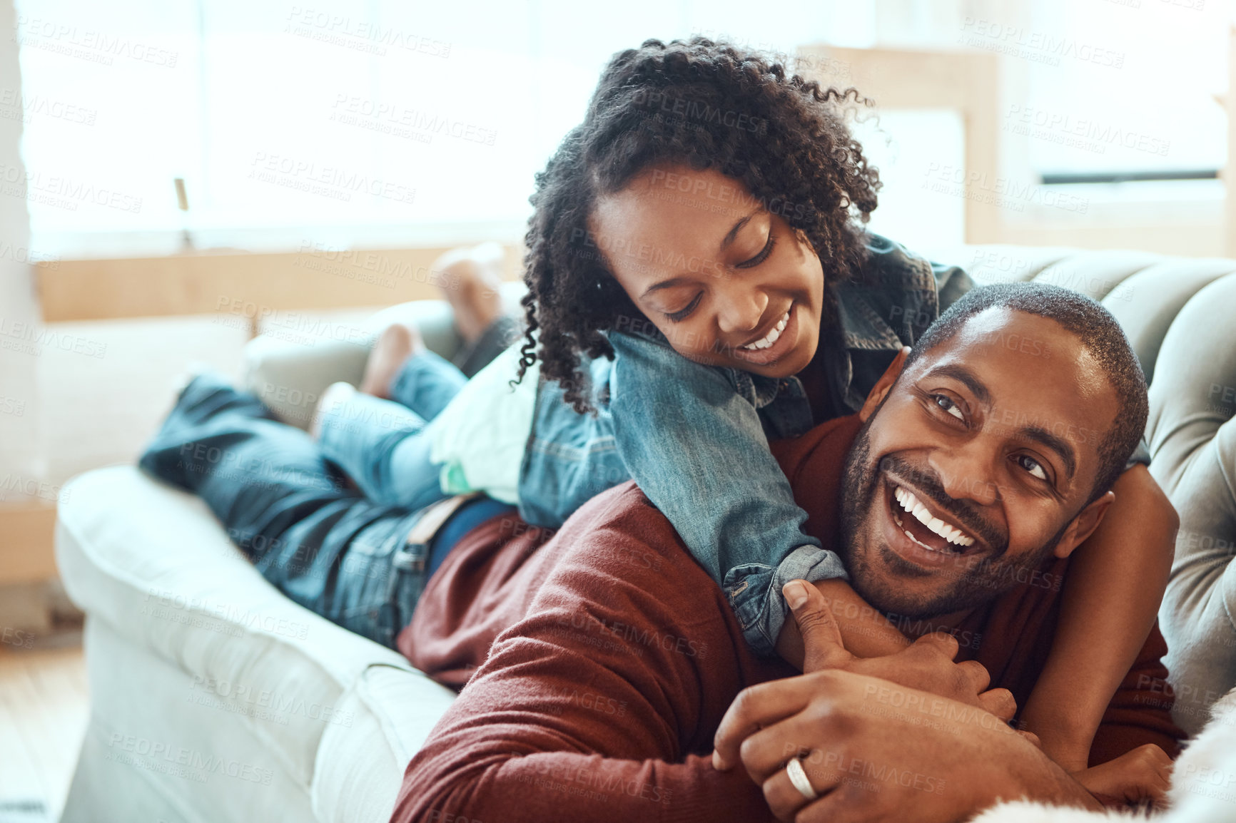 Buy stock photo Black family, love and father with girl on sofa enjoying quality time, bonding and relax together on weekend. Living room, happiness and daughter embrace, hugging and laying with dad on couch at home