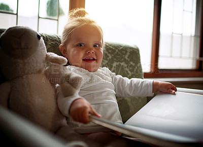 Buy stock photo Child, portrait and reading book for learning, language development and cognitive skills on living room couch. Girl, kid and fantasy story for education, relax and knowledge on sofa in house lounge