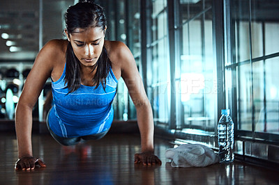 Buy stock photo Workout, push up and woman in gym for strength, wellness and arms training for fitness. Serious, health and female athlete with exercise for body goals for muscles and power in sports center.