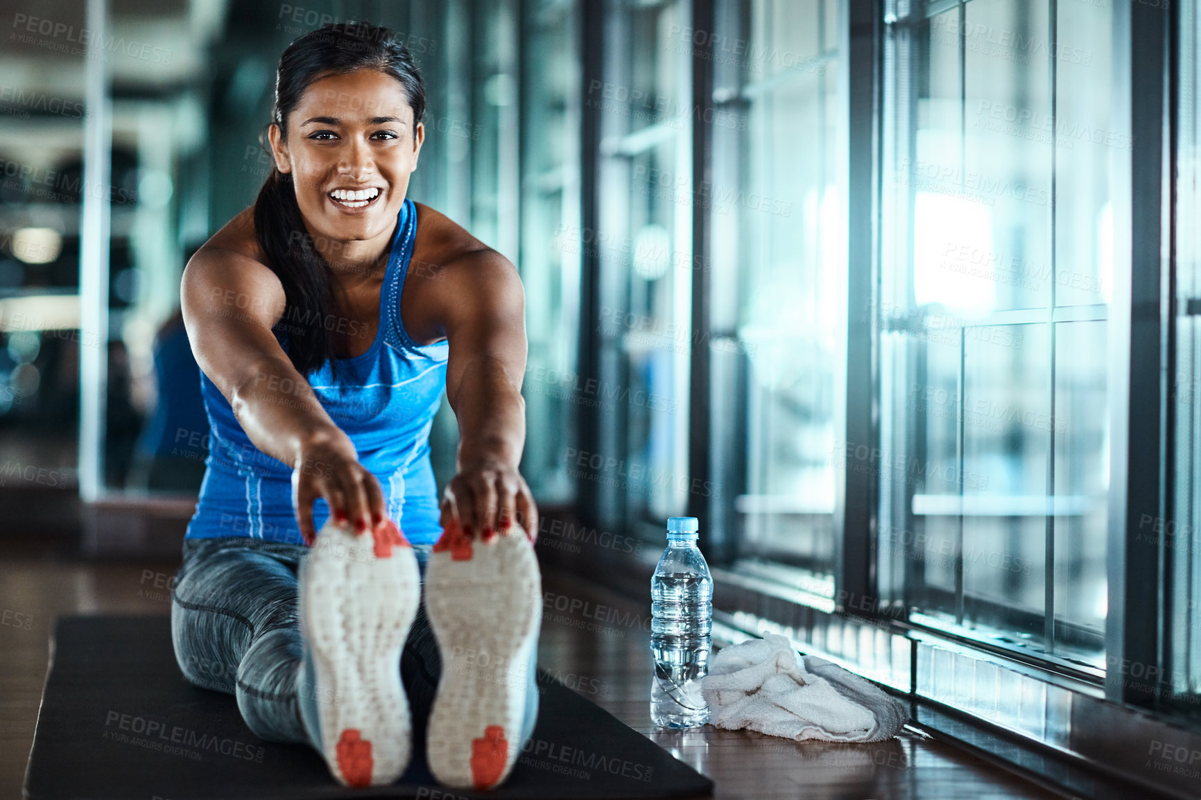 Buy stock photo Exercise, girl and stretching legs at gym to start workout, muscle coordination or flexibility. Health club, woman or warm up portrait on mat for fitness preparation, getting ready or enhance posture