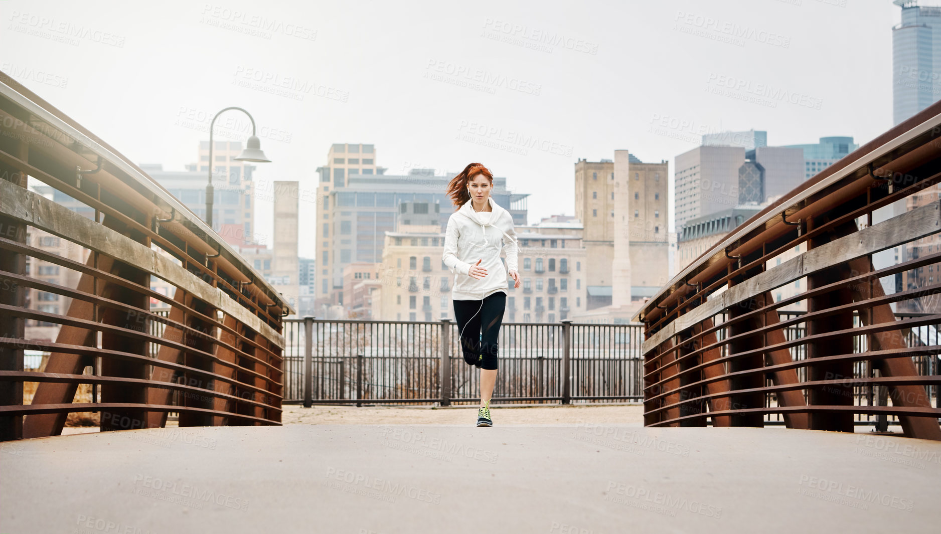 Buy stock photo Endurance, woman and running by bridge in city, race and speed with fitness exercise Germany. Training, female runner and preparation for marathon, challenge and healthy living with workout outdoor