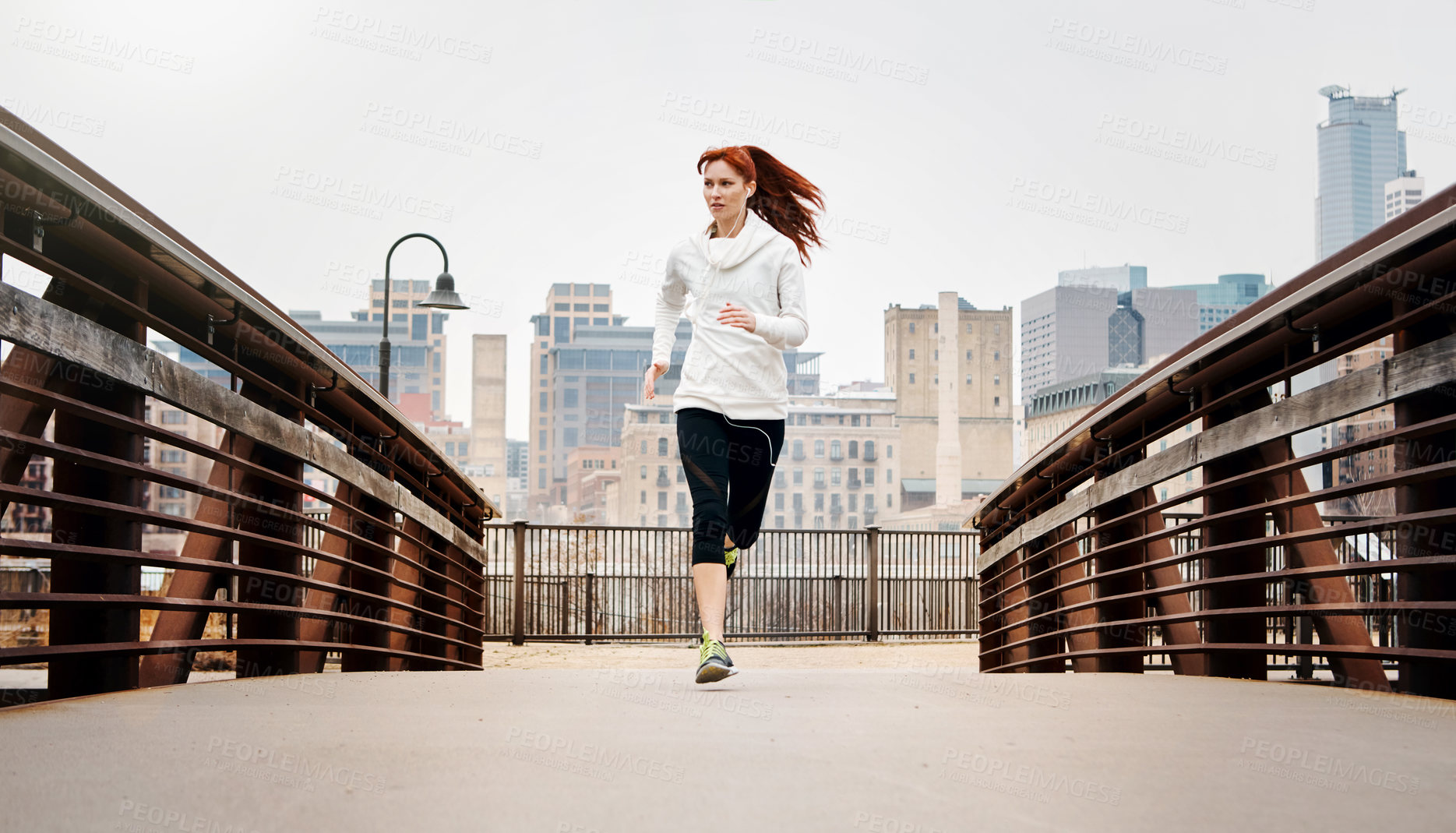 Buy stock photo Exercise, woman and running by bridge in city, endurance and speed with fitness in Germany. Training, female runner and preparation for marathon, challenge and healthy living with workout outdoor