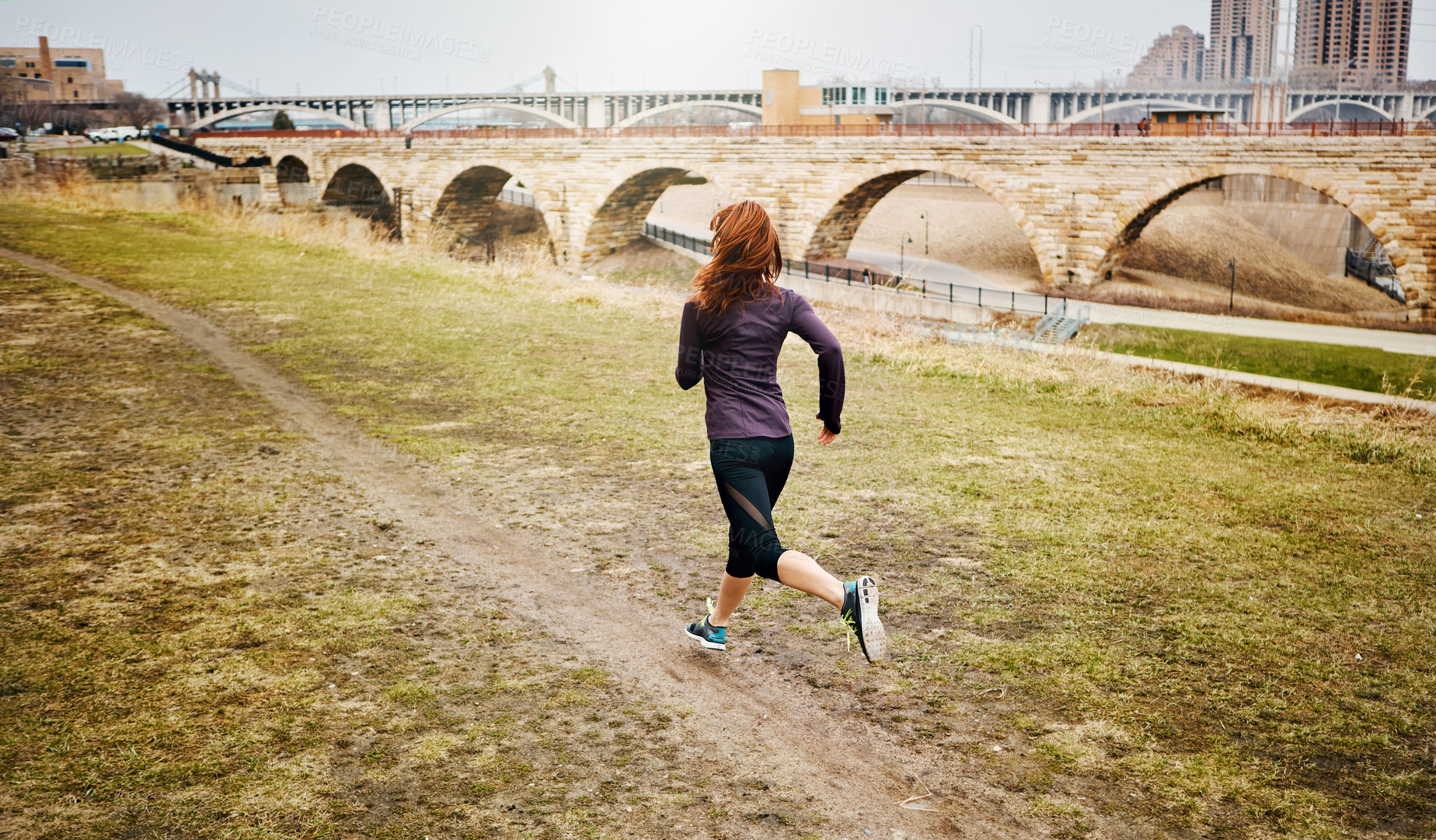 Buy stock photo Back, woman and running by bridge in nature, endurance and speed with fitness in Germany. Training, female runner and preparation for marathon, challenge and healthy living with workout outdoor